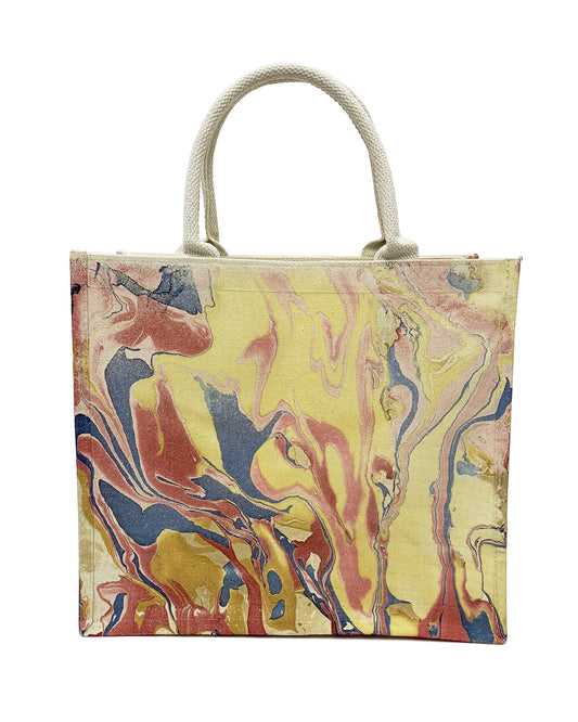 Front view of LanHeal 'Fire Phoenix' handmade lacquer-dyed canvas bag on white background, showcasing dynamic, flame-like swirls in yellow, red, and blue that resemble a majestic phoenix rising from fire.