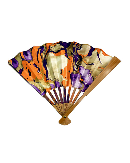 Partially open view of LanHeal 'Strange Atmosphere' handmade folding fan on white background, showing a mesmerizing design.